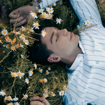 man lying on grass